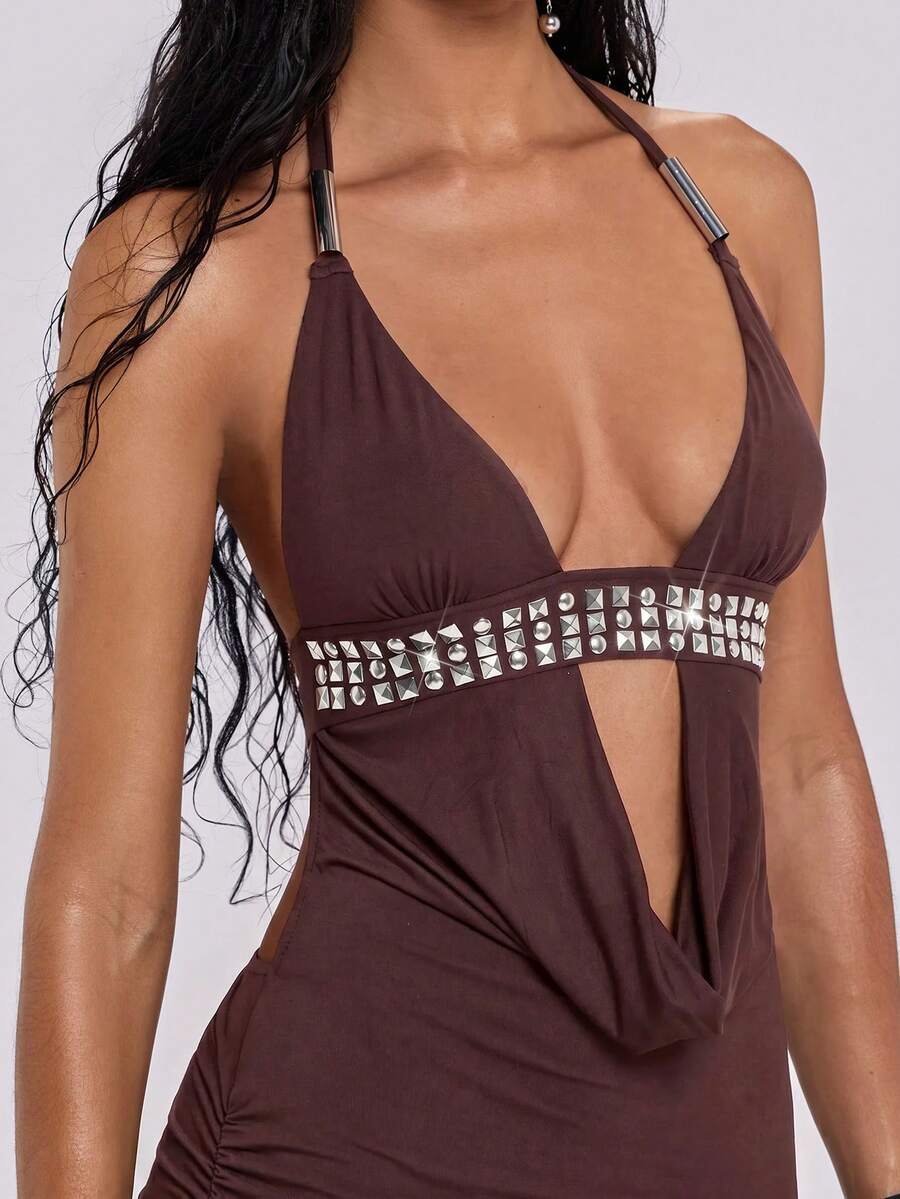 Women's slim fit halter neck bodycon mini dress featuring a backless design with knot tie back details.
