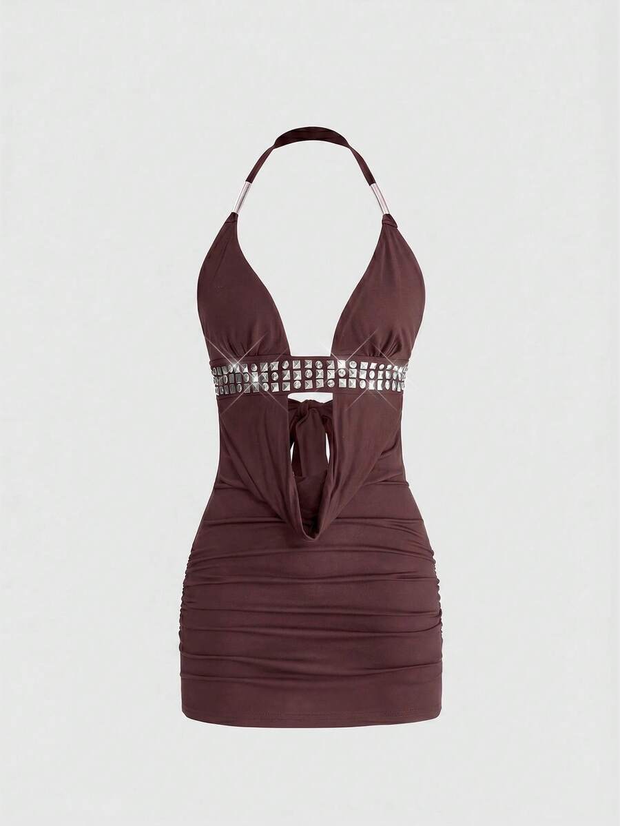 Women's slim fit halter neck bodycon mini dress featuring a backless design with knot tie back details.