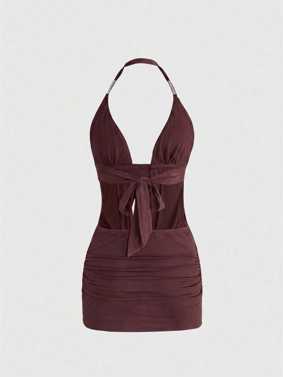 Women's slim fit halter neck bodycon mini dress featuring a backless design with knot tie back details.