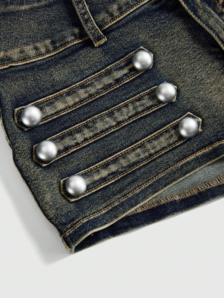 Front view of women's ultra low waist denim mini shorts with double metal button accents and zipper fly
