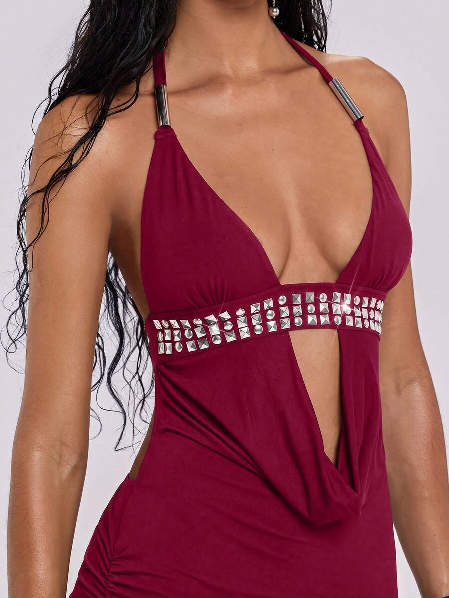 Women's slim fit halter neck bodycon mini dress featuring a backless design with knot tie back details.