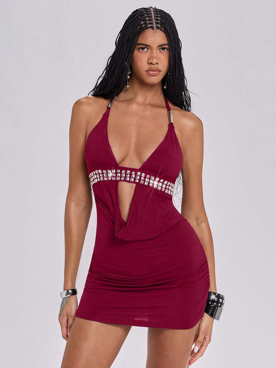 Women's slim fit halter neck bodycon mini dress featuring a backless design with knot tie back details.