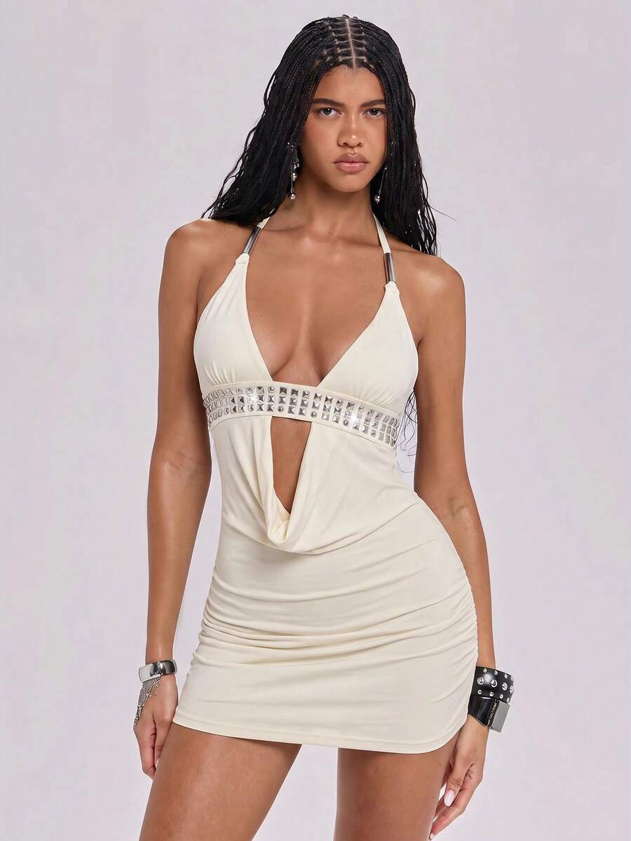 Women's slim fit halter neck bodycon mini dress featuring a backless design with knot tie back details.