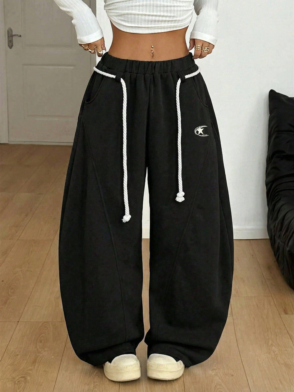 Plus size unisex baggy wide leg sweatpants in black with high elastic drawstring waist and side pockets