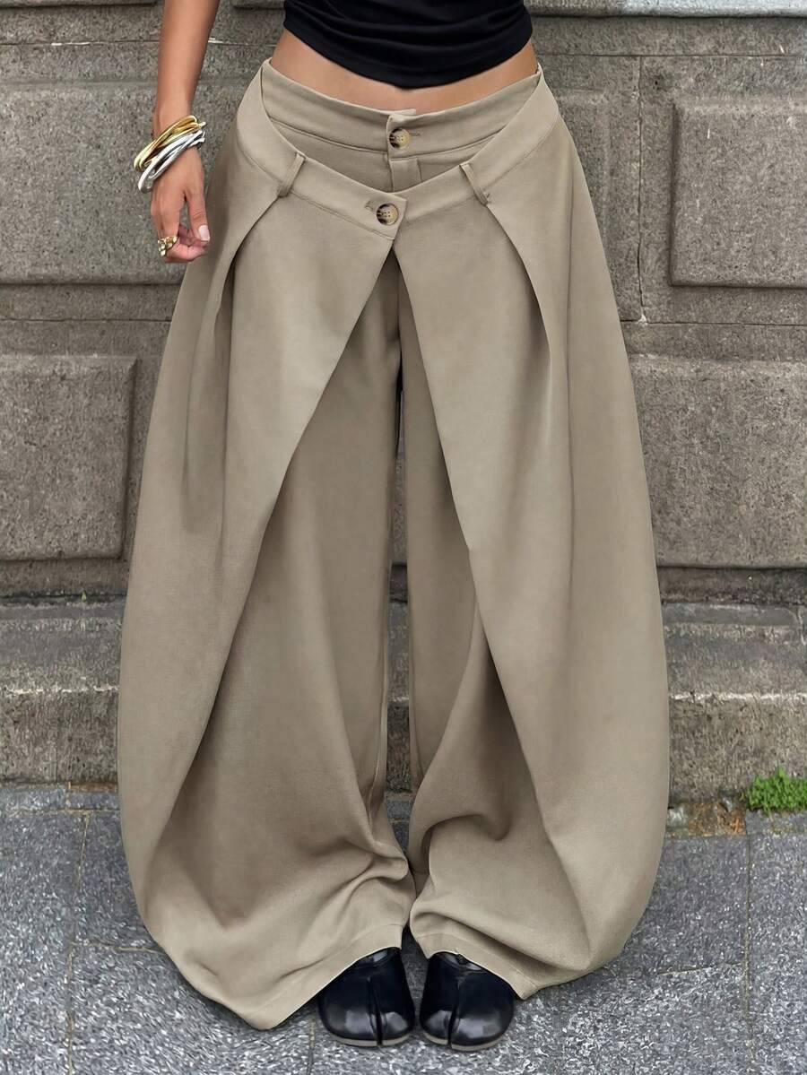 Women's loose fit pleated wide leg pants in royal blue pinstripe woven fabric with zipper fly closure.