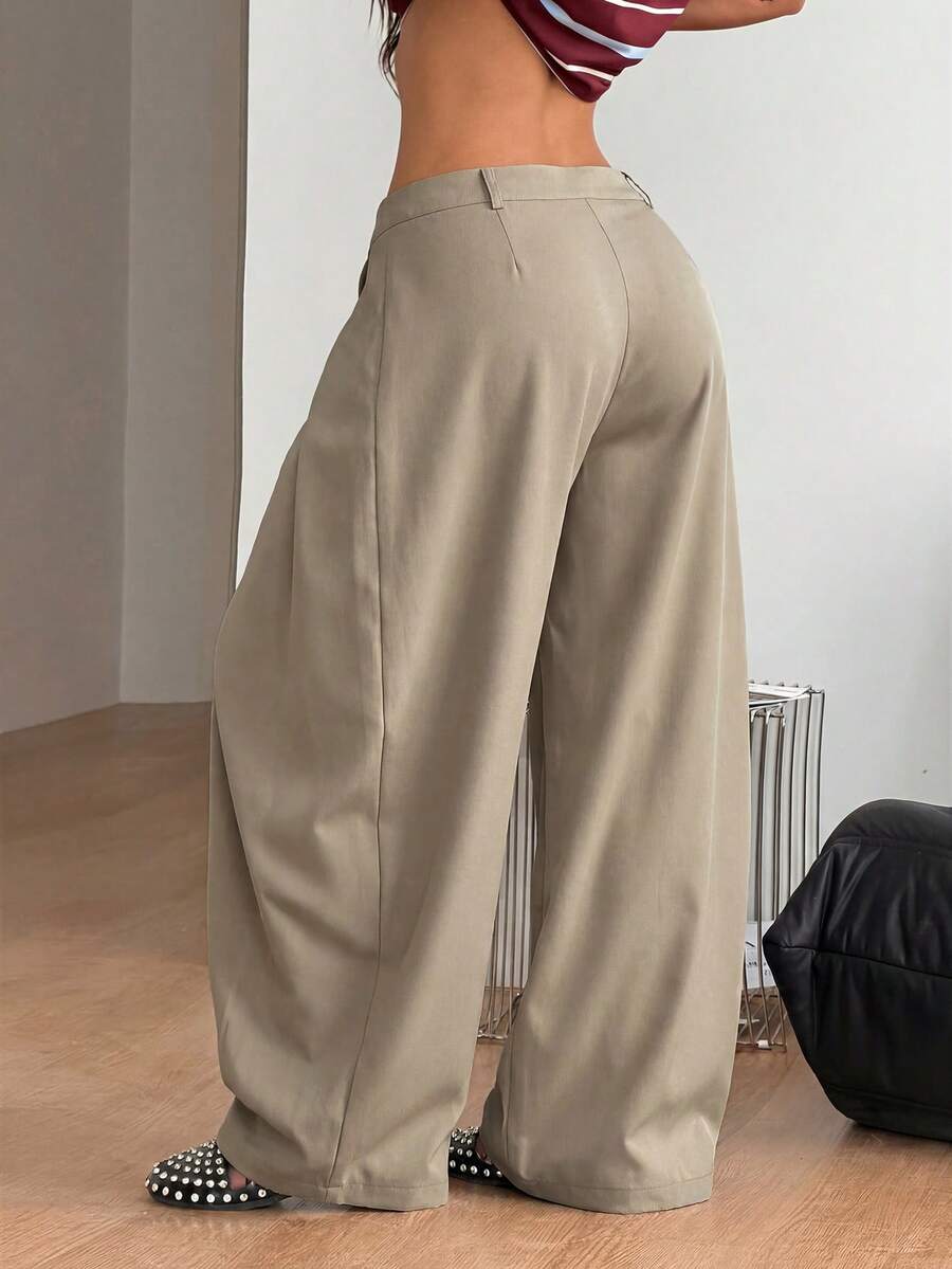 Women's loose fit pleated wide leg pants in royal blue pinstripe woven fabric with zipper fly closure.