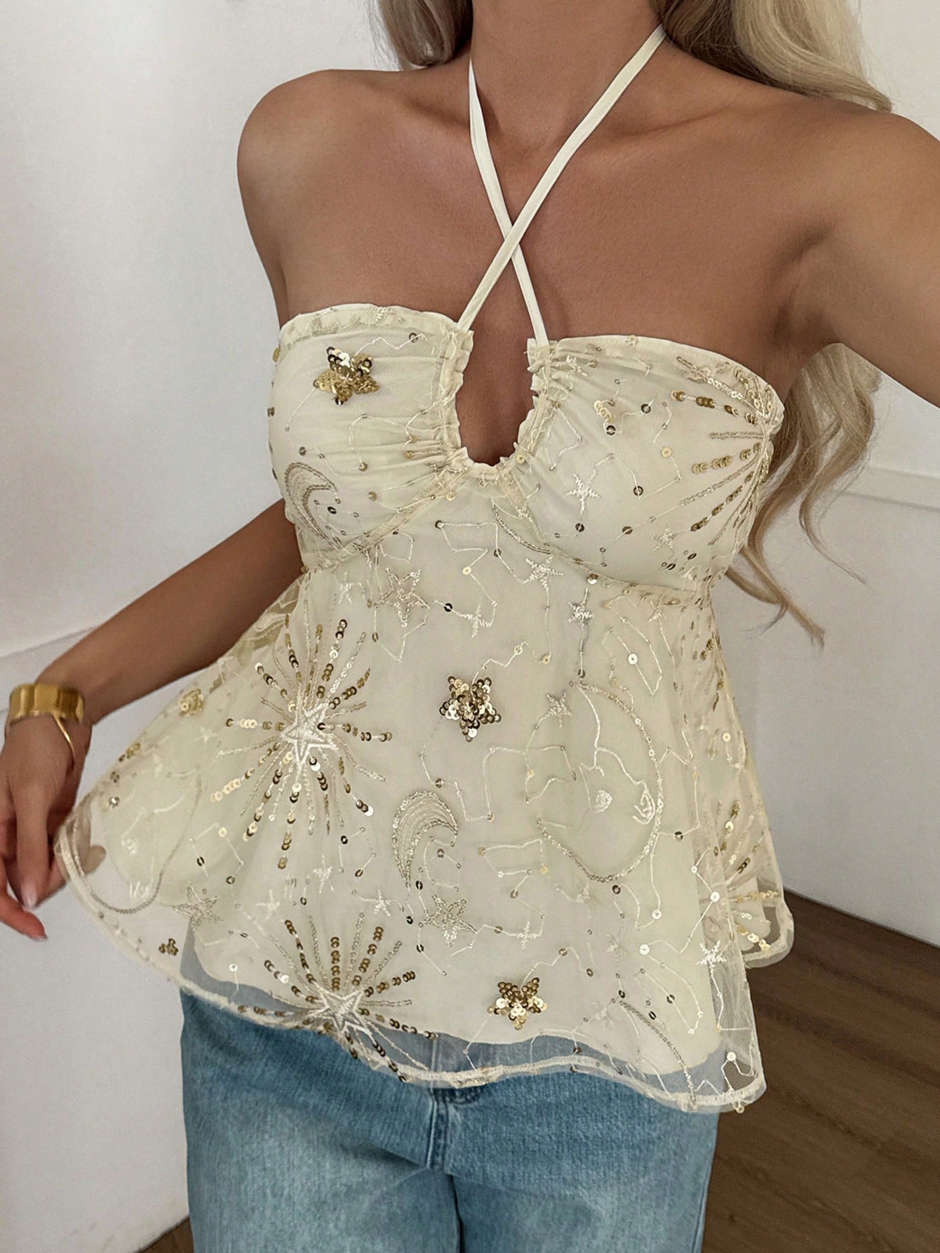 Women's coquette mesh crisscross halter cami top with star sequin applique details and flared peplum hem