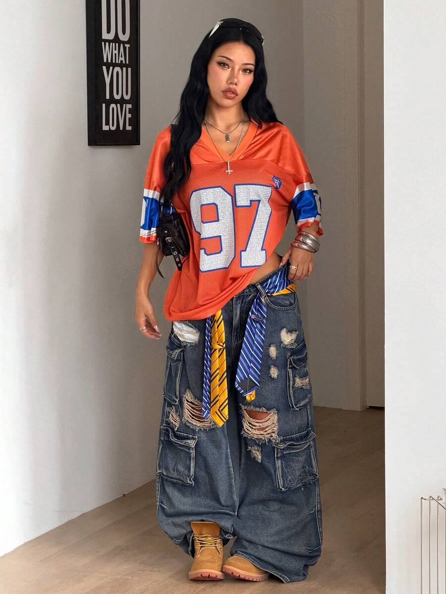 Women's oversized mesh jersey t-shirt with sporty number print, short drop-shoulder sleeves, and V-neckline.