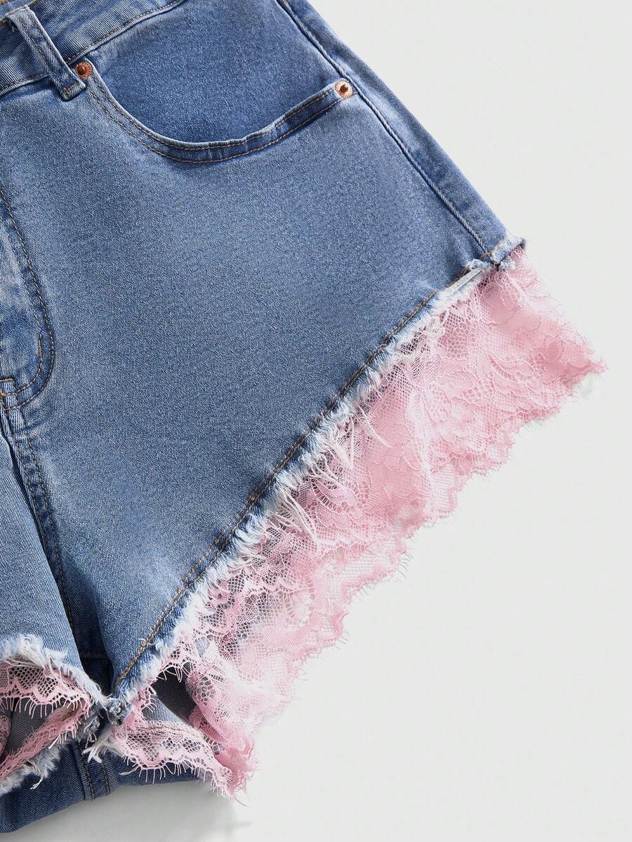 Front view of women's plus size skinny denim shorts featuring lace patchwork detailing, mid-rise waist, button zipper closure, and classic pockets.