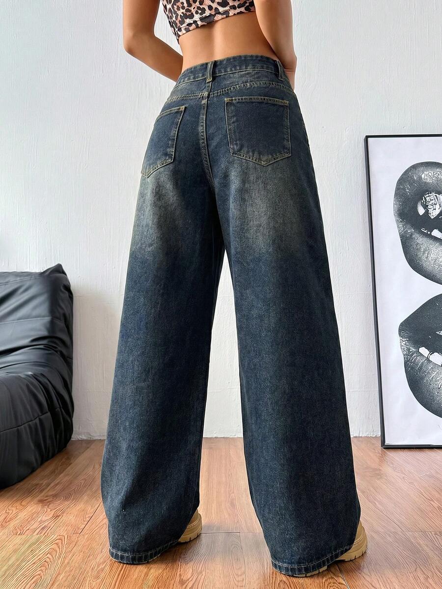 Women's relaxed fit wide leg denim jeans with pockets and a zipper fly.