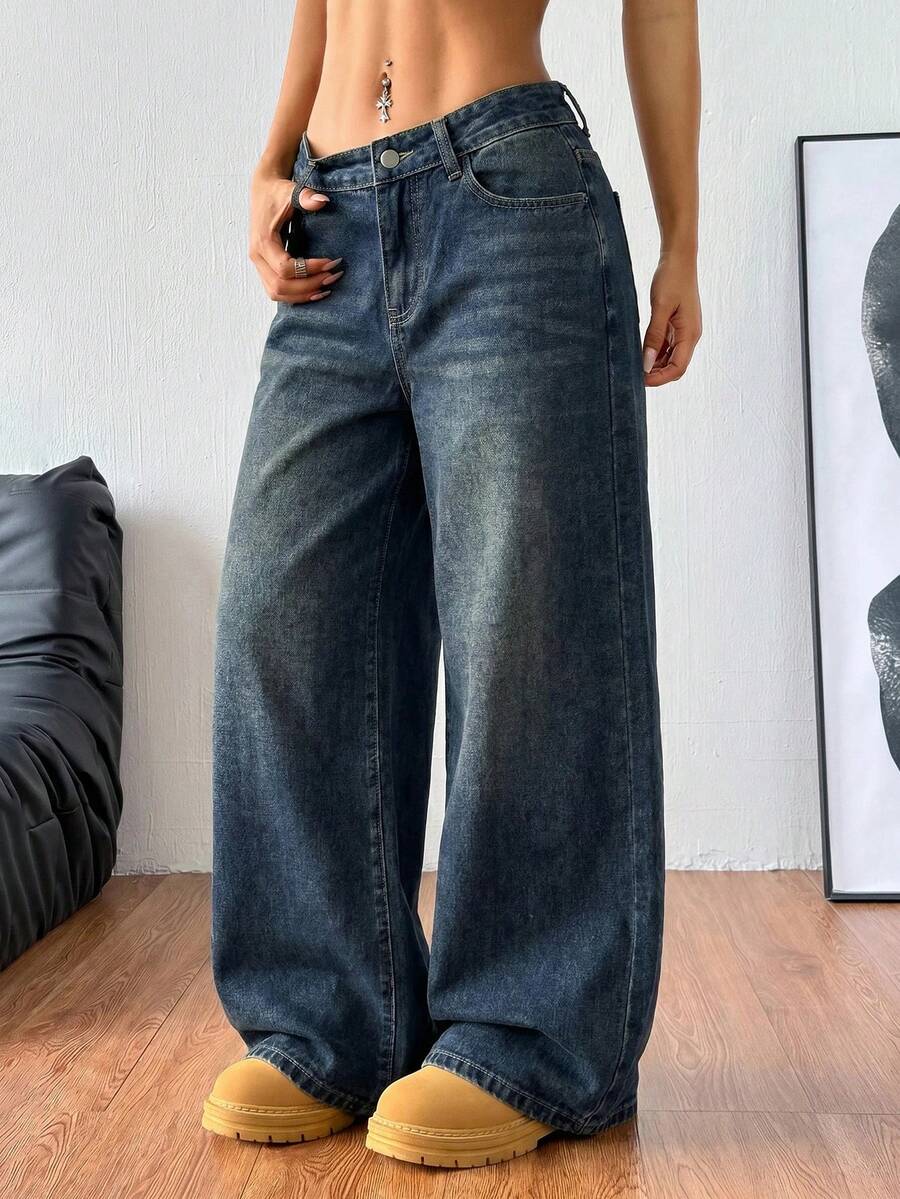 Women's relaxed fit wide leg denim jeans with pockets and a zipper fly.