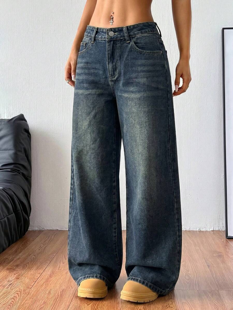 Women's relaxed fit wide leg denim jeans with pockets and a zipper fly.