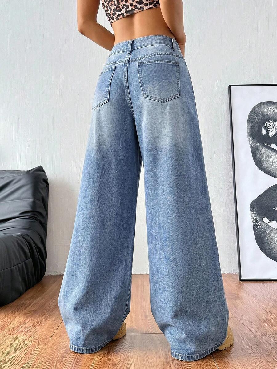 Women's loose wide-leg jeans in light wash denim with low waist and extra-long relaxed fit