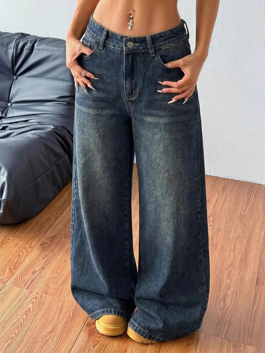 Women's relaxed fit wide leg denim jeans with pockets and a zipper fly.