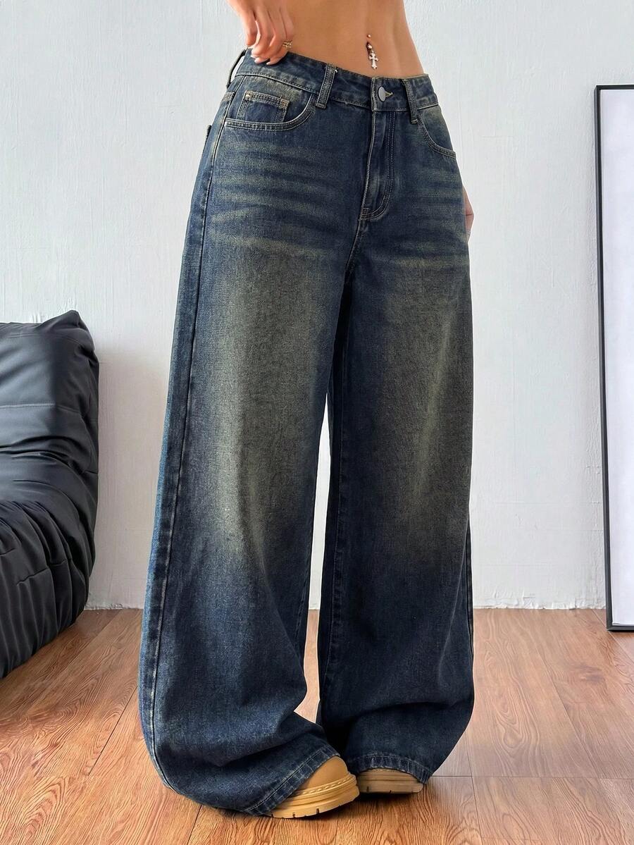 Women's relaxed fit wide leg denim jeans with pockets and a zipper fly.
