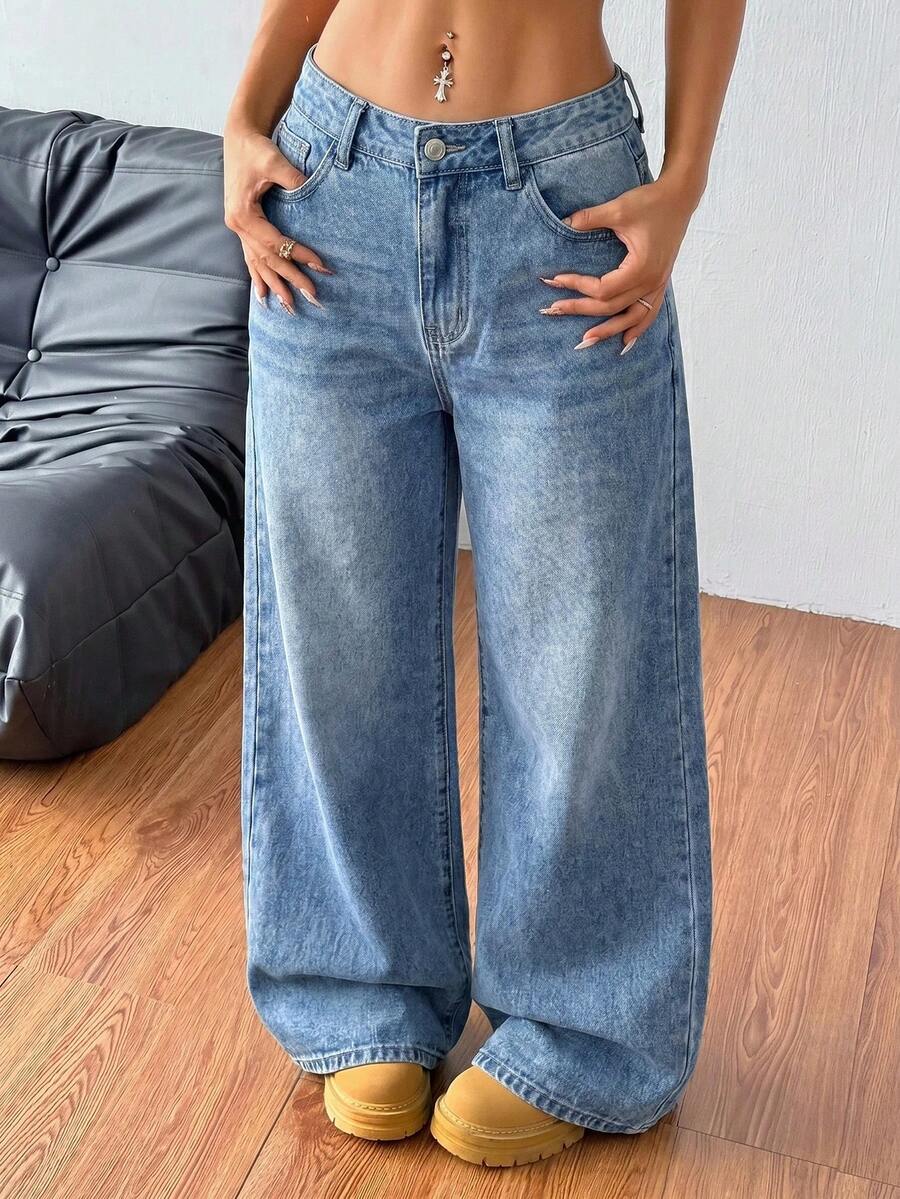 Women's loose wide-leg jeans in light wash denim with low waist and extra-long relaxed fit