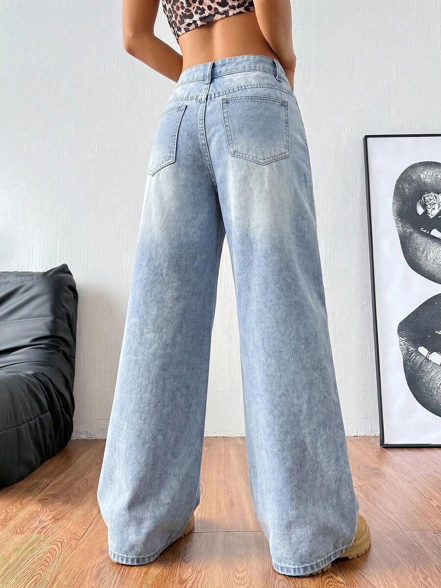 Women's loose wide-leg jeans in light wash denim with low waist and extra-long relaxed fit