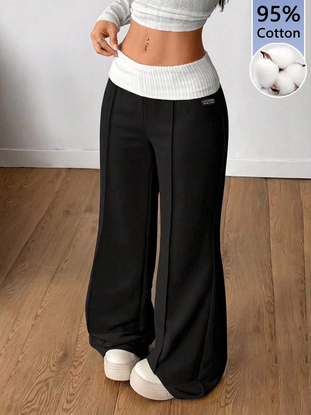 Women's wide leg flare lounge pants made of 95% cotton with a low elastic waistband and extra long hem.