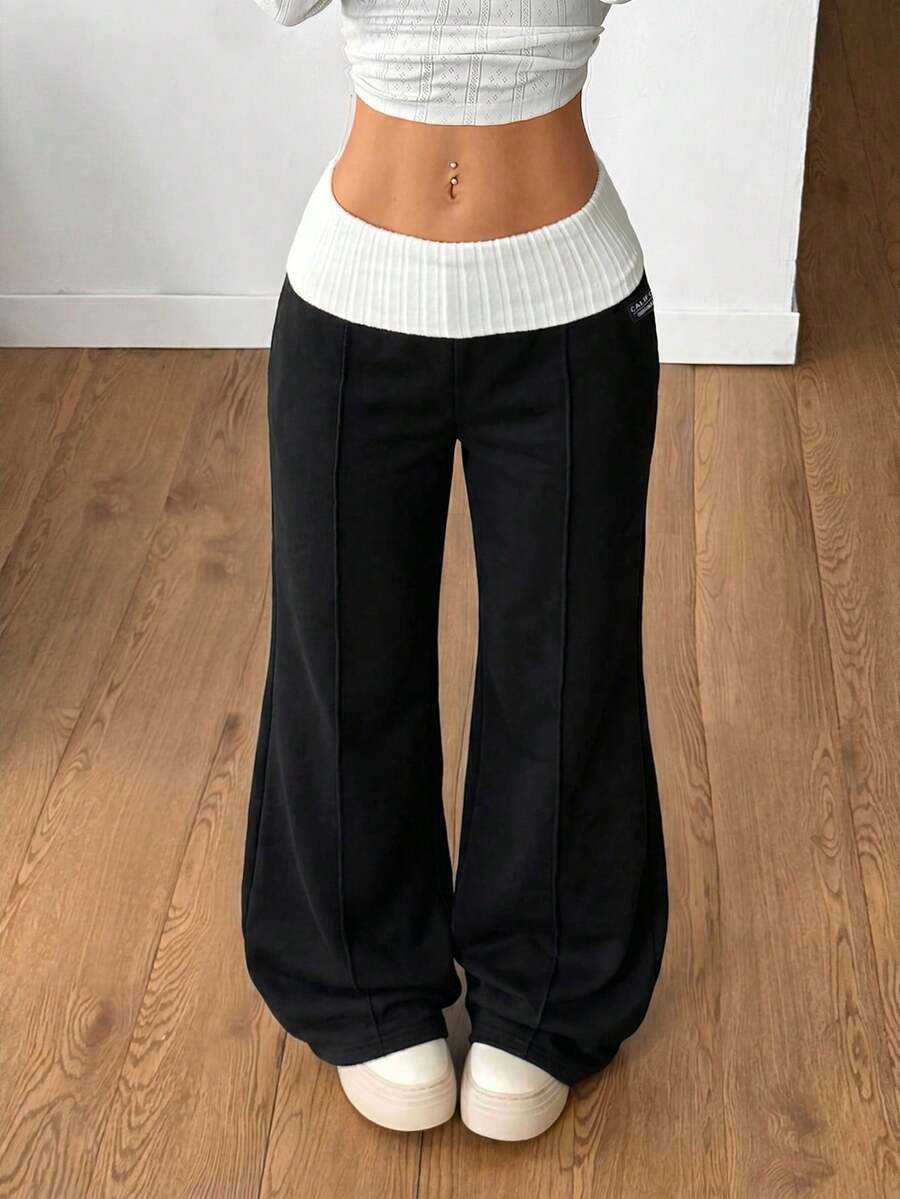 Women's wide leg flare lounge pants made of 95% cotton with a low elastic waistband and extra long hem.