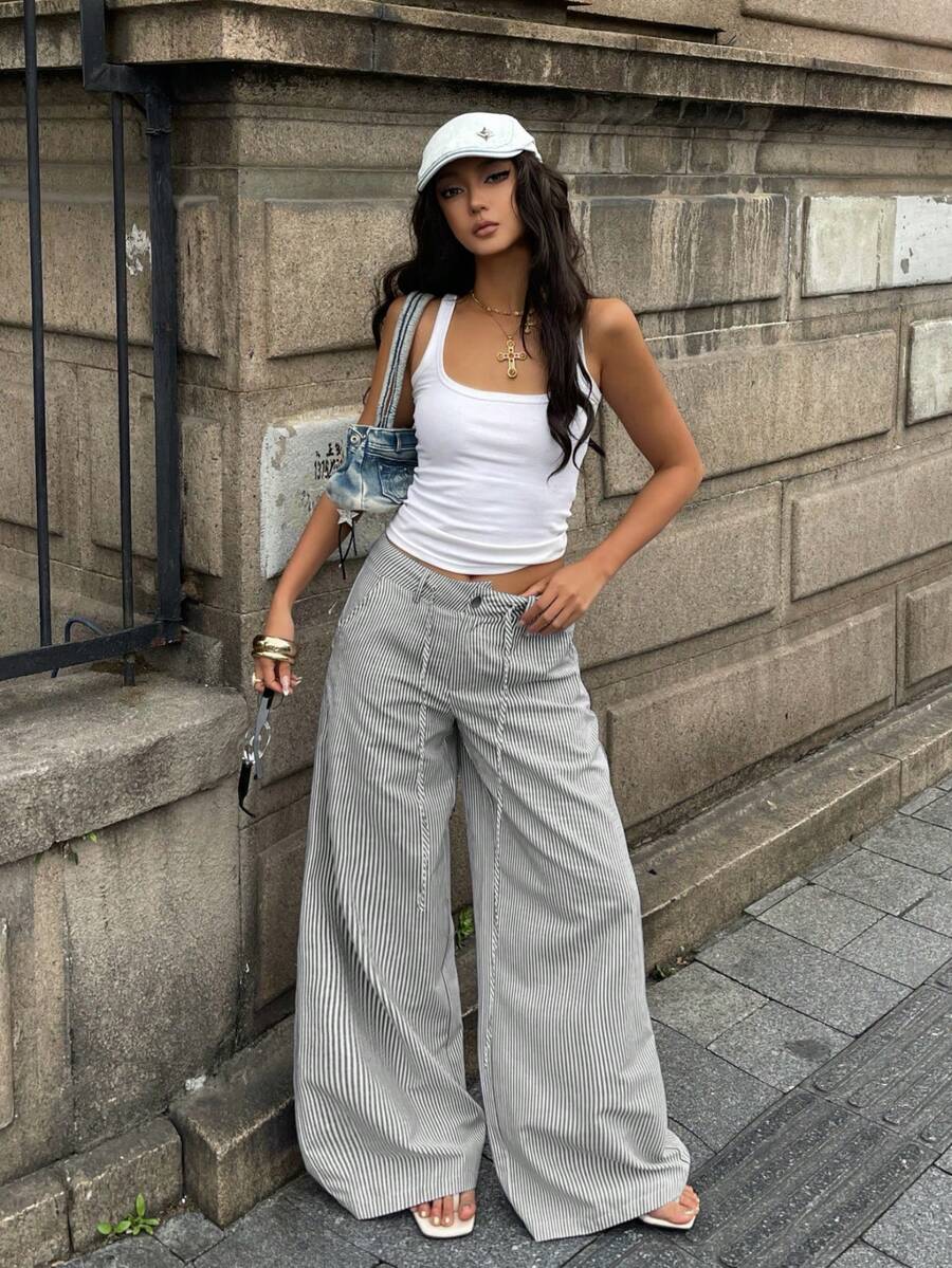 Women's casual straight leg striped woven pants featuring a low waist and zipper fly closure.