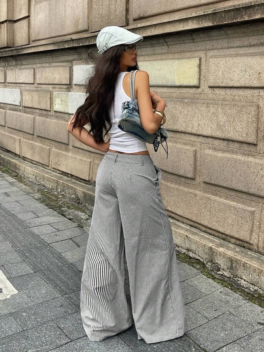 Women's casual straight leg striped woven pants featuring a low waist and zipper fly closure.