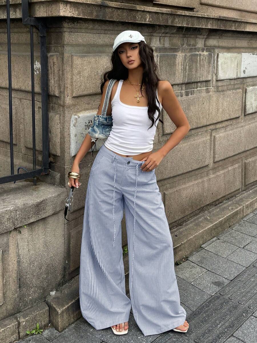 Women's casual straight leg striped woven pants featuring a low waist and zipper fly closure.