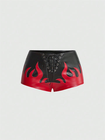 Punk ultra low waist skinny PU mini shorts with flame embroidery, rhinestone details, zipper fly closure, and a graphic Halloween-inspired festival style.