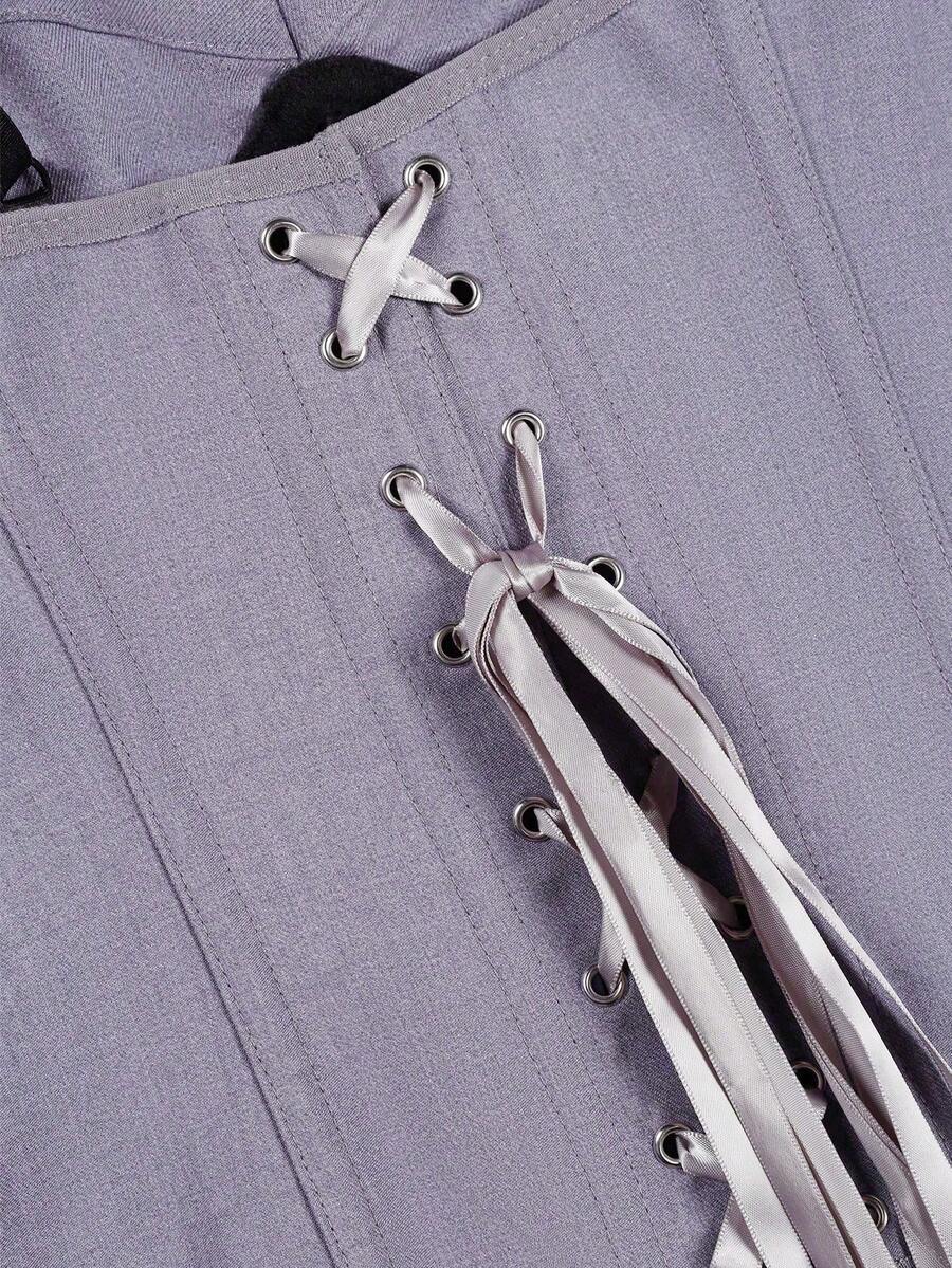 Women's light grey boned corset top featuring lace-up cargo details and spaghetti straps.