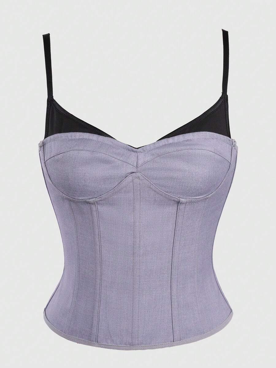 Women's light grey boned corset top featuring lace-up cargo details and spaghetti straps.
