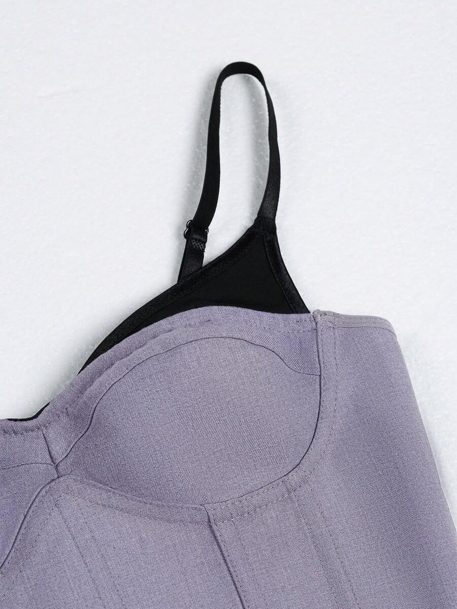 Women's light grey boned corset top featuring lace-up cargo details and spaghetti straps.