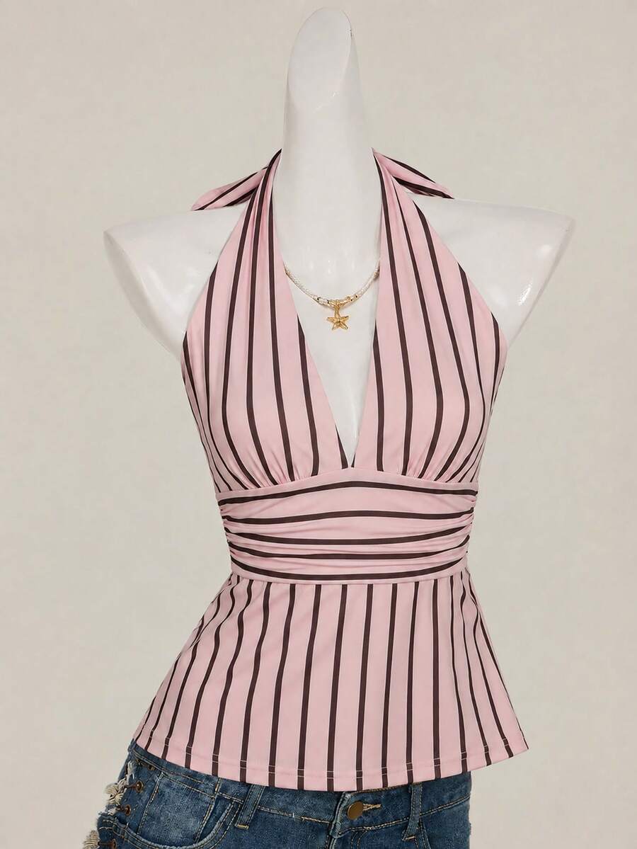 White women's deep V-neck halter tank top with ruched waist, backless design, rib-knit texture, and ruffle hem