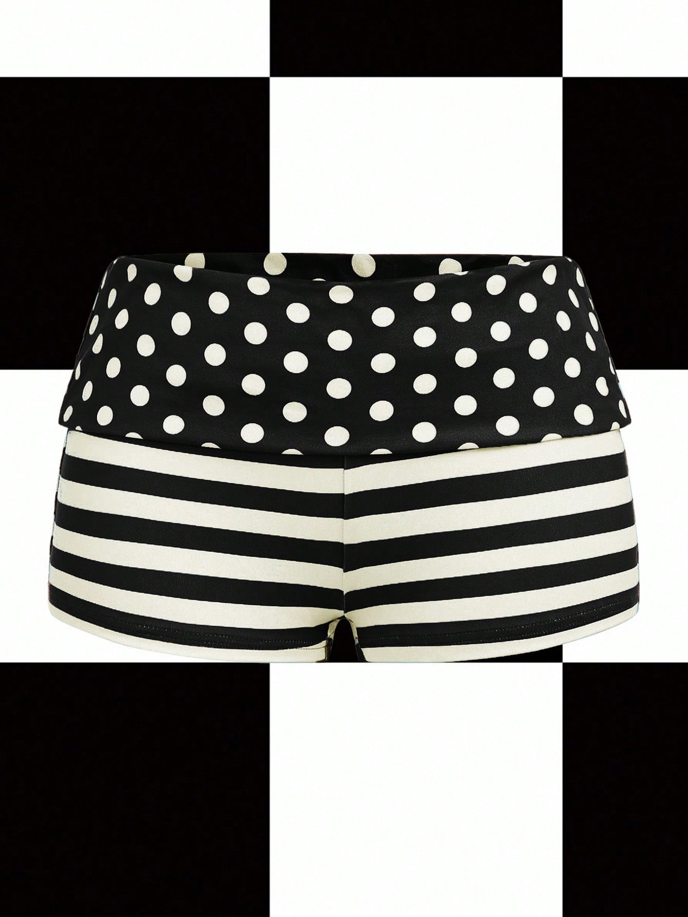 Women's black low waist mini track shorts with contrast polka dot, striped, geometric, and plant-inspired print details, elastic waistband, and skinny fit