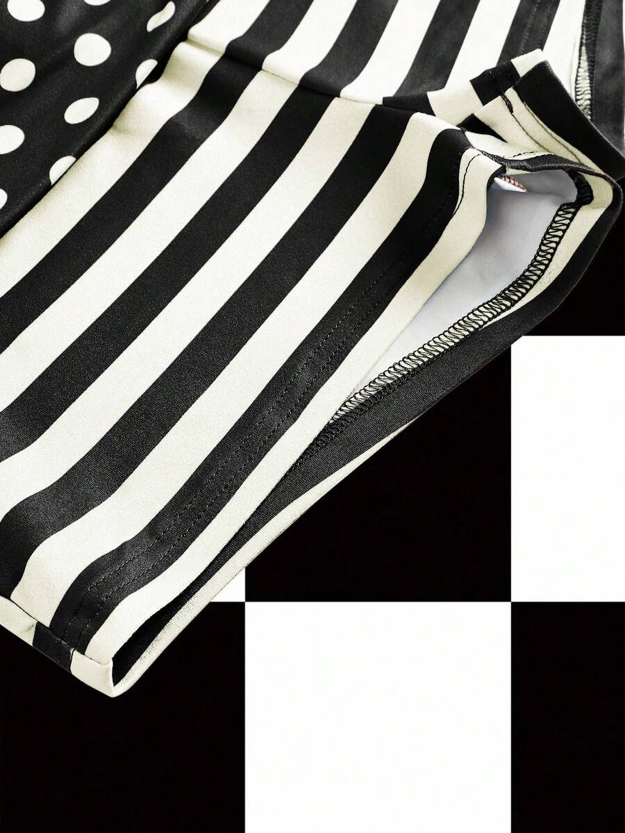 Women's black low waist mini track shorts with contrast polka dot, striped, geometric, and plant-inspired print details, elastic waistband, and skinny fit