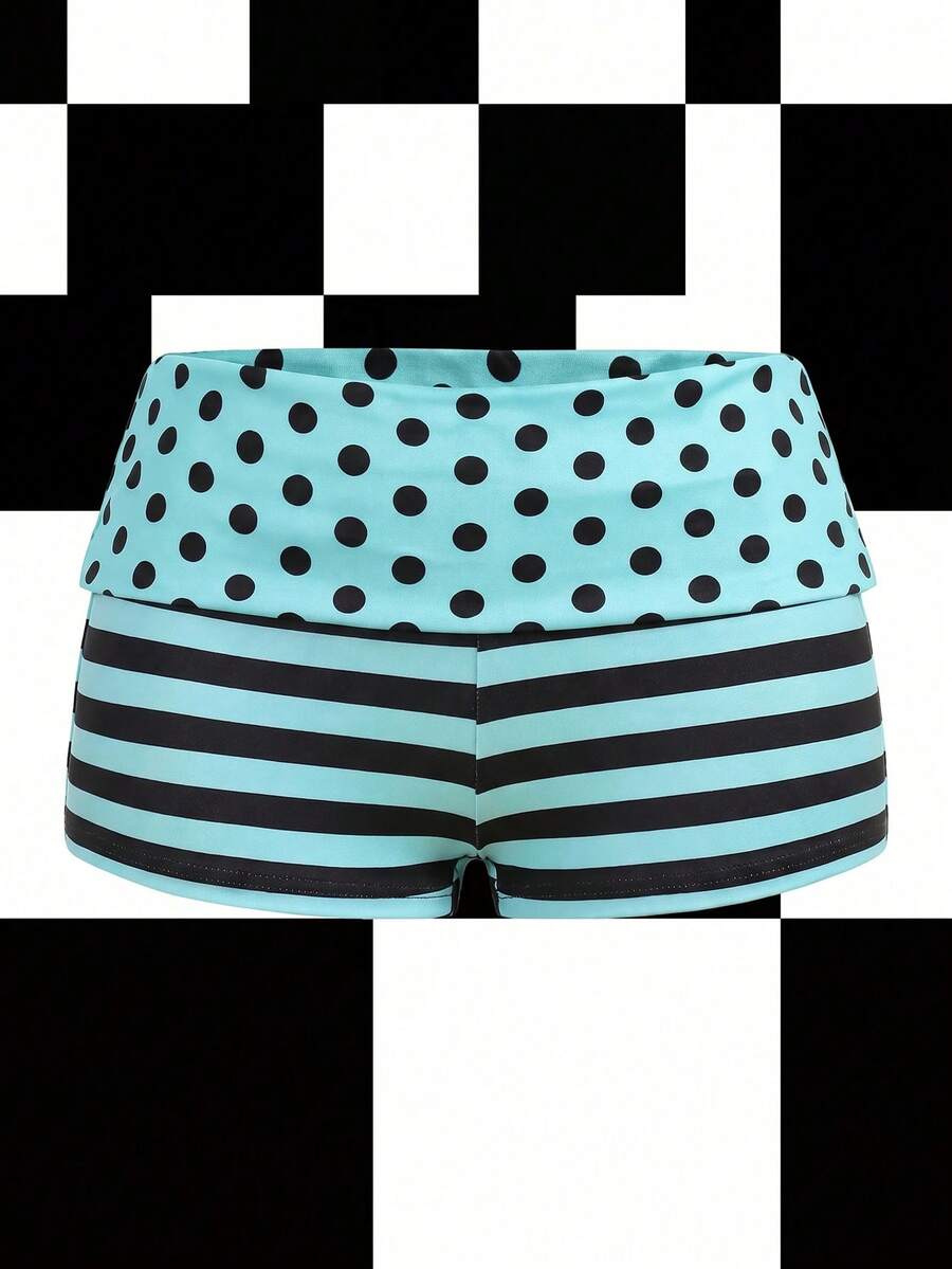 Women's black low waist mini track shorts with contrast polka dot, striped, geometric, and plant-inspired print details, elastic waistband, and skinny fit