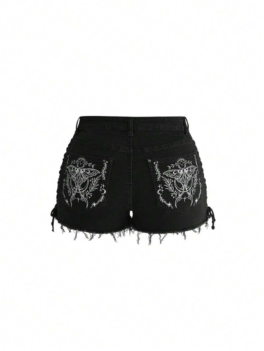 Plus size black gothic mini shorts with heart embroidery, graphic pocket pattern, lace-up detail, raw hem, and zipper fly