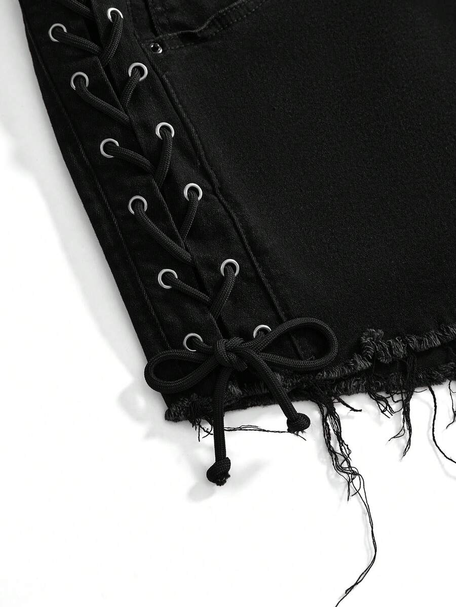 Plus size black gothic mini shorts with heart embroidery, graphic pocket pattern, lace-up detail, raw hem, and zipper fly