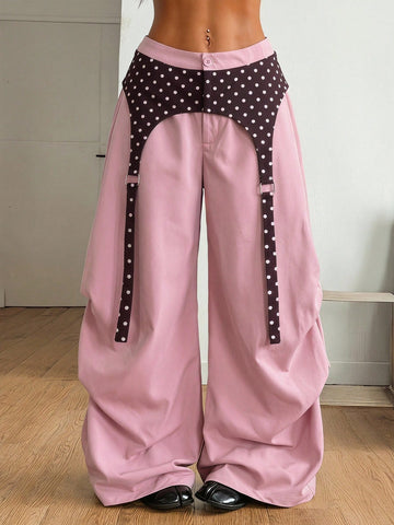 Women's brown baggy parachute pants with polka dot graphic print, low waist, and loose streetwear fit
