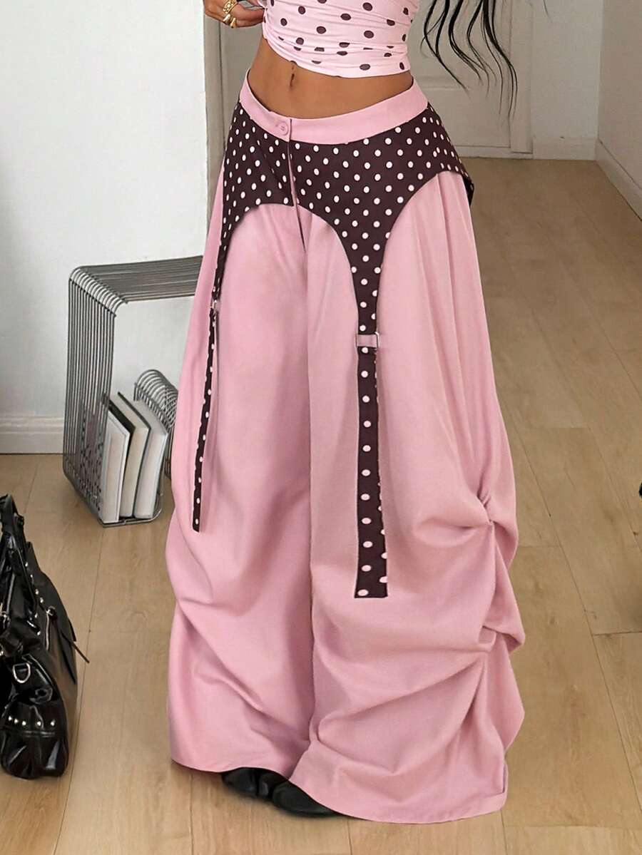 Women's brown baggy parachute pants with polka dot graphic print, low waist, and loose streetwear fit