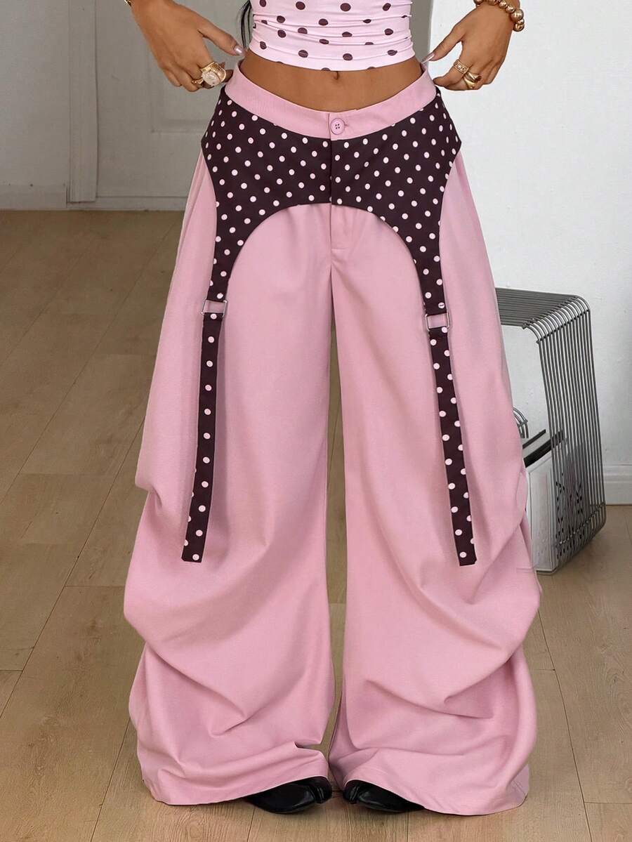 Women's brown baggy parachute pants with polka dot graphic print, low waist, and loose streetwear fit