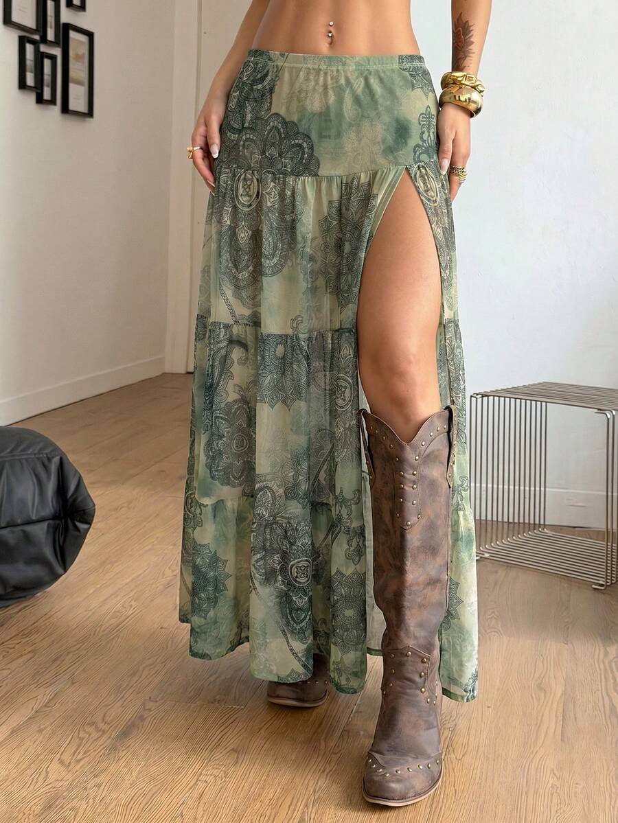 Women's low rise flared long skirt featuring an all-over print, split thigh accent, and textured semi-sheer fabric.