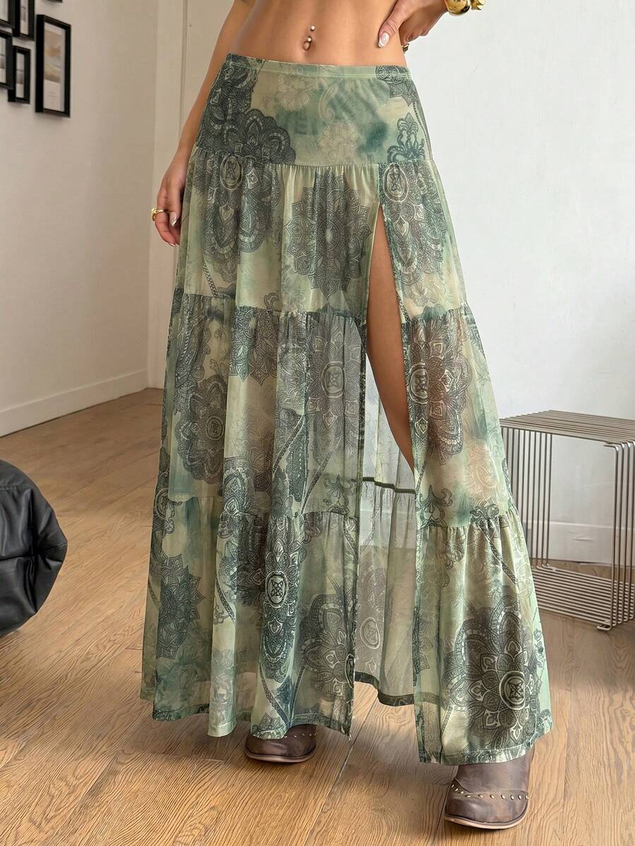 Women's low rise flared long skirt featuring an all-over print, split thigh accent, and textured semi-sheer fabric.