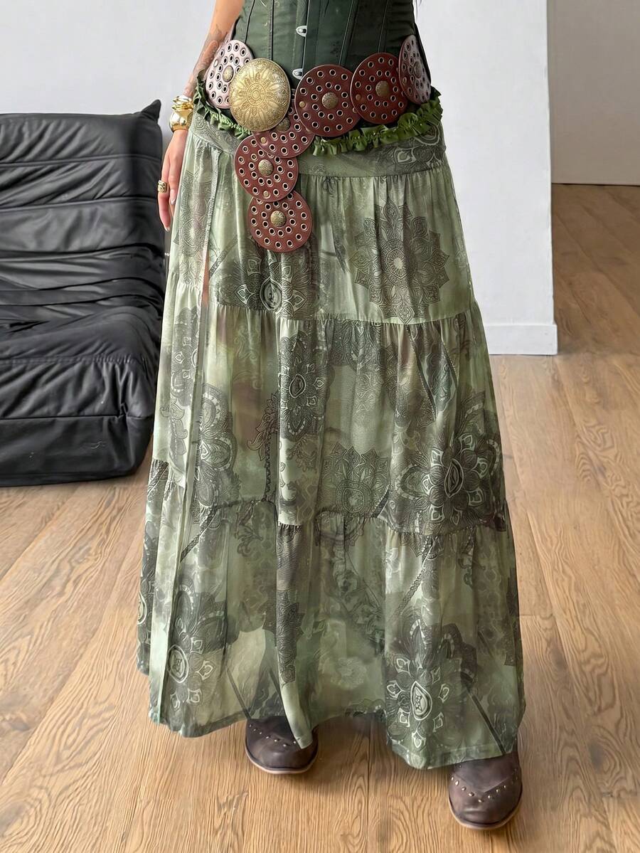 Women's low rise flared long skirt featuring an all-over print, split thigh accent, and textured semi-sheer fabric.
