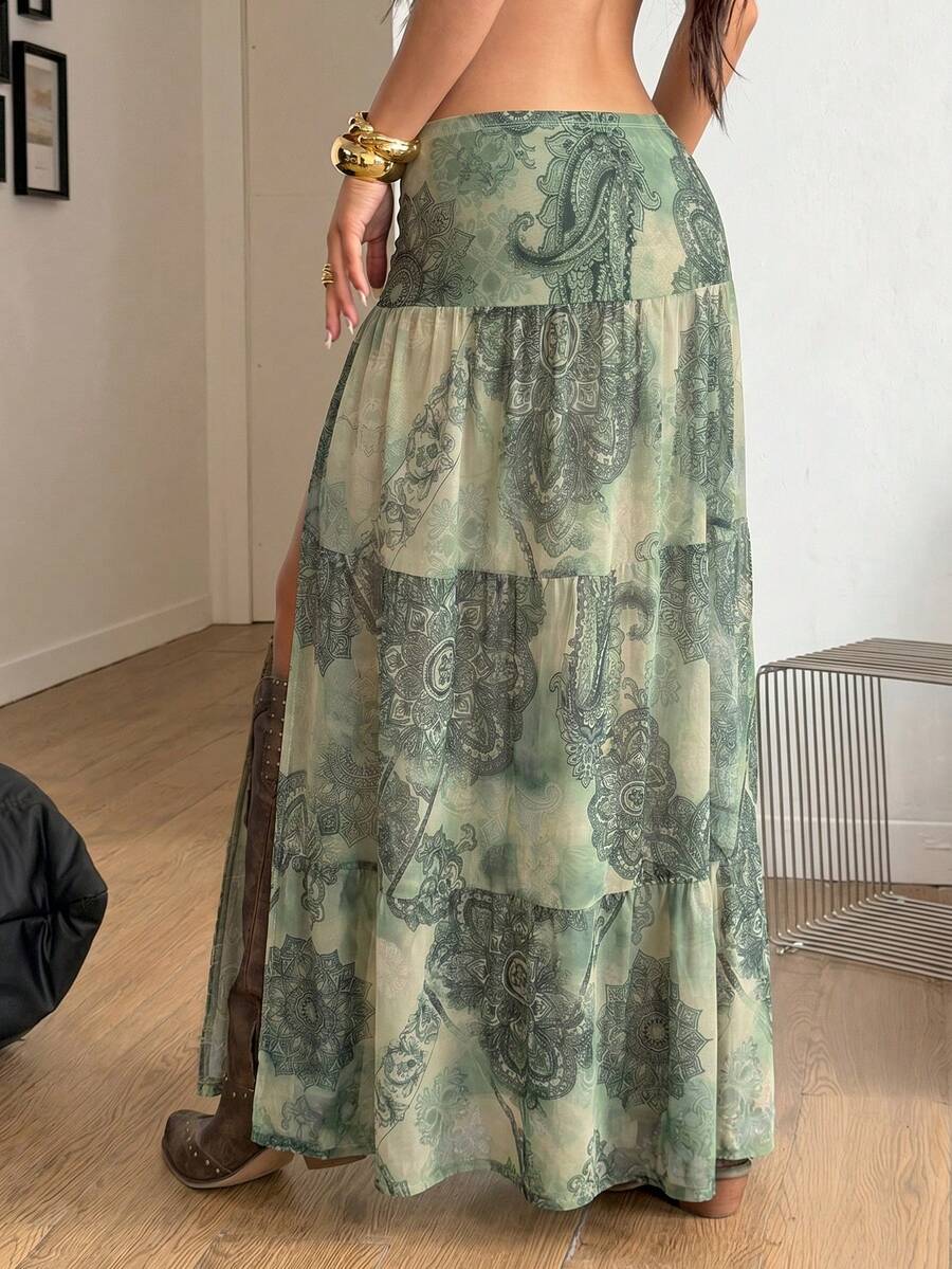 Women's low rise flared long skirt featuring an all-over print, split thigh accent, and textured semi-sheer fabric.