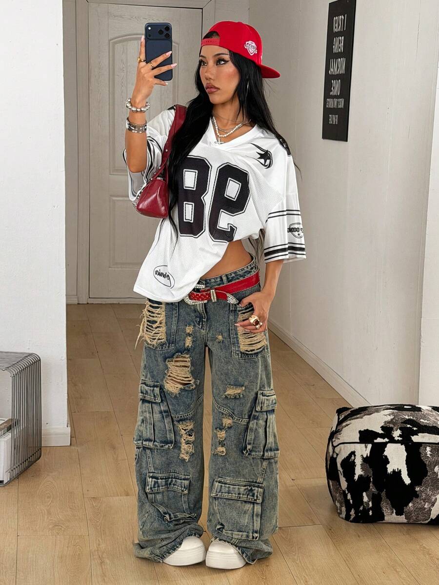 Women's oversized mesh jersey t-shirt with sporty number print, short drop-shoulder sleeves, and V-neckline.