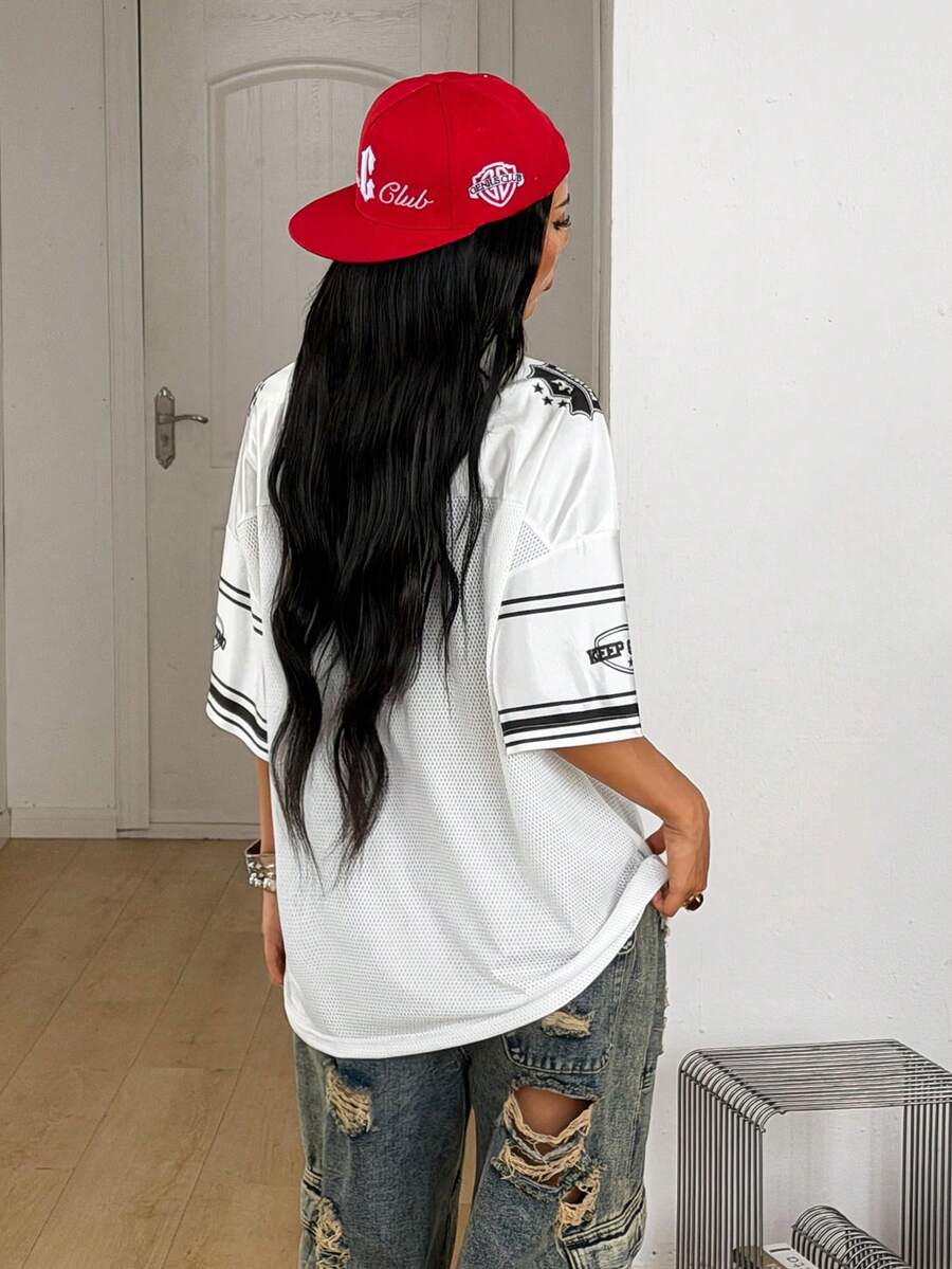 Women's oversized mesh jersey t-shirt with sporty number print, short drop-shoulder sleeves, and V-neckline.