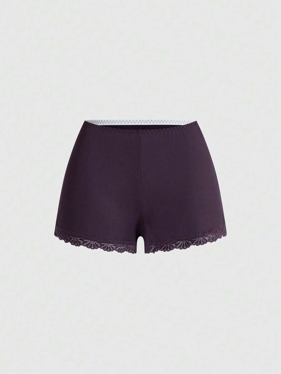 Ribbed lace camisole and shorts pajama set with spaghetti straps, bow detail, and contrast lace trim
