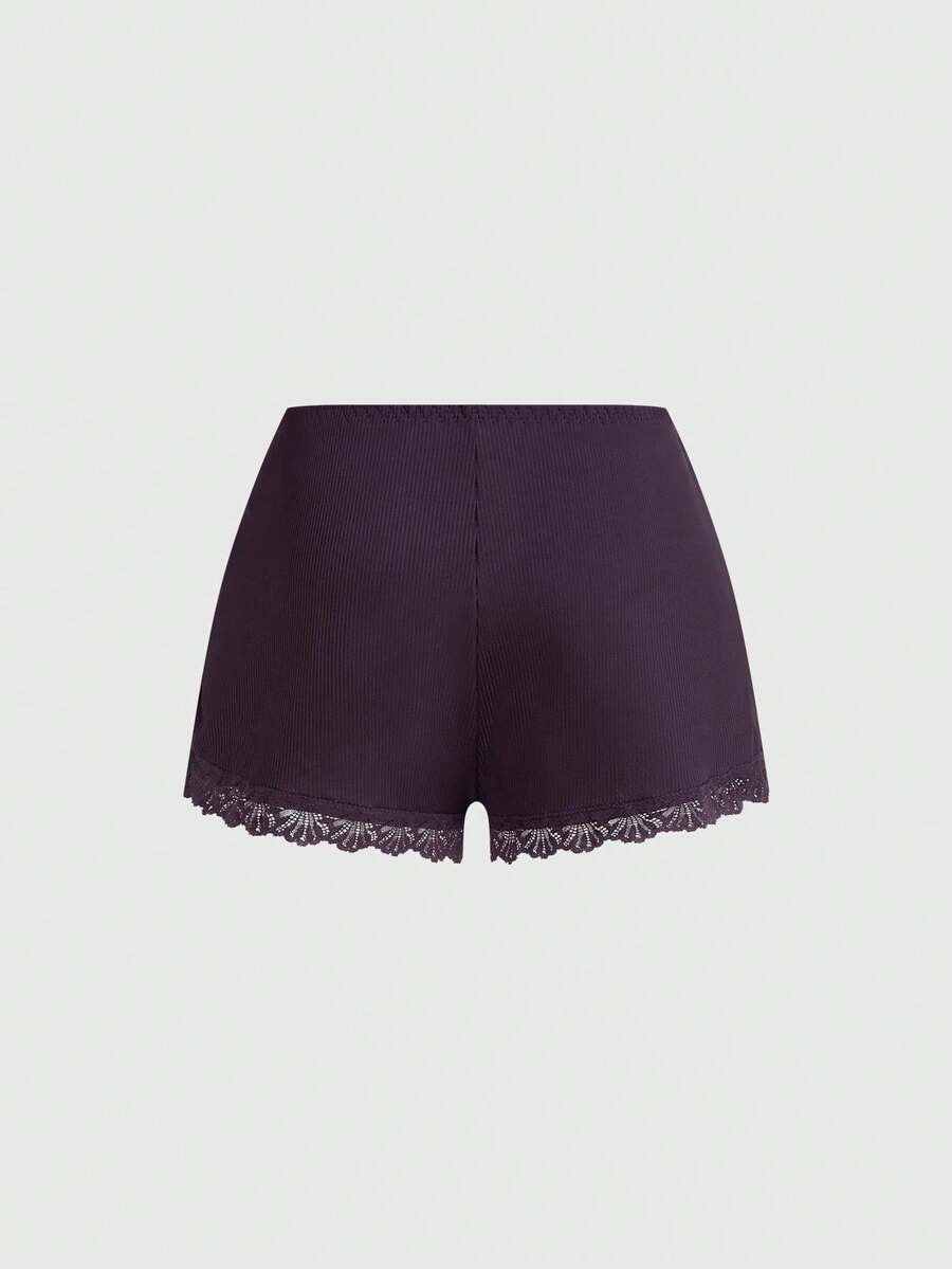 Ribbed lace camisole and shorts pajama set with spaghetti straps, bow detail, and contrast lace trim