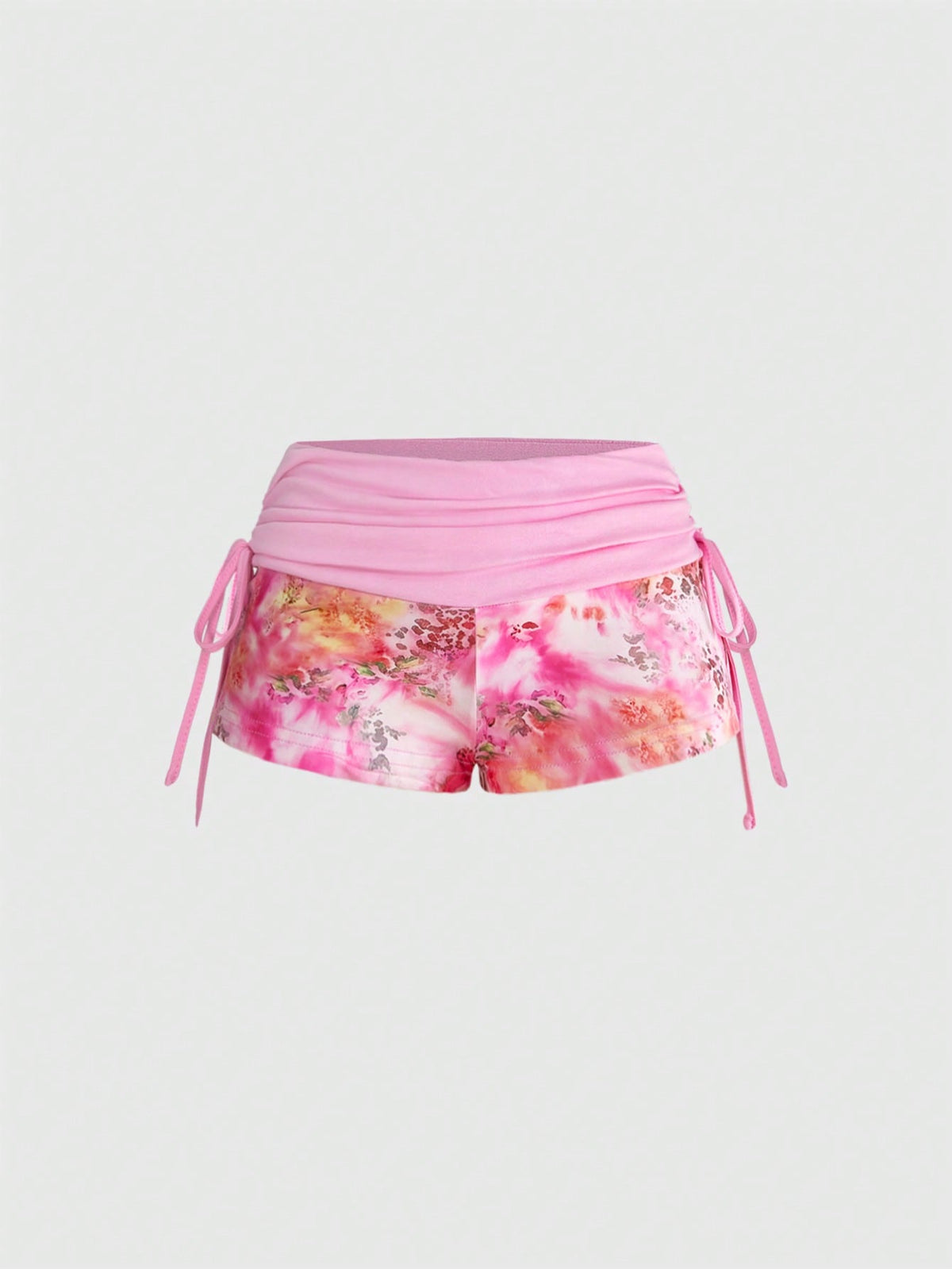 Women's low waist mini track shorts with elastic waistband, drawstring knot, ruched details, and plant pattern in a Y2K boho style