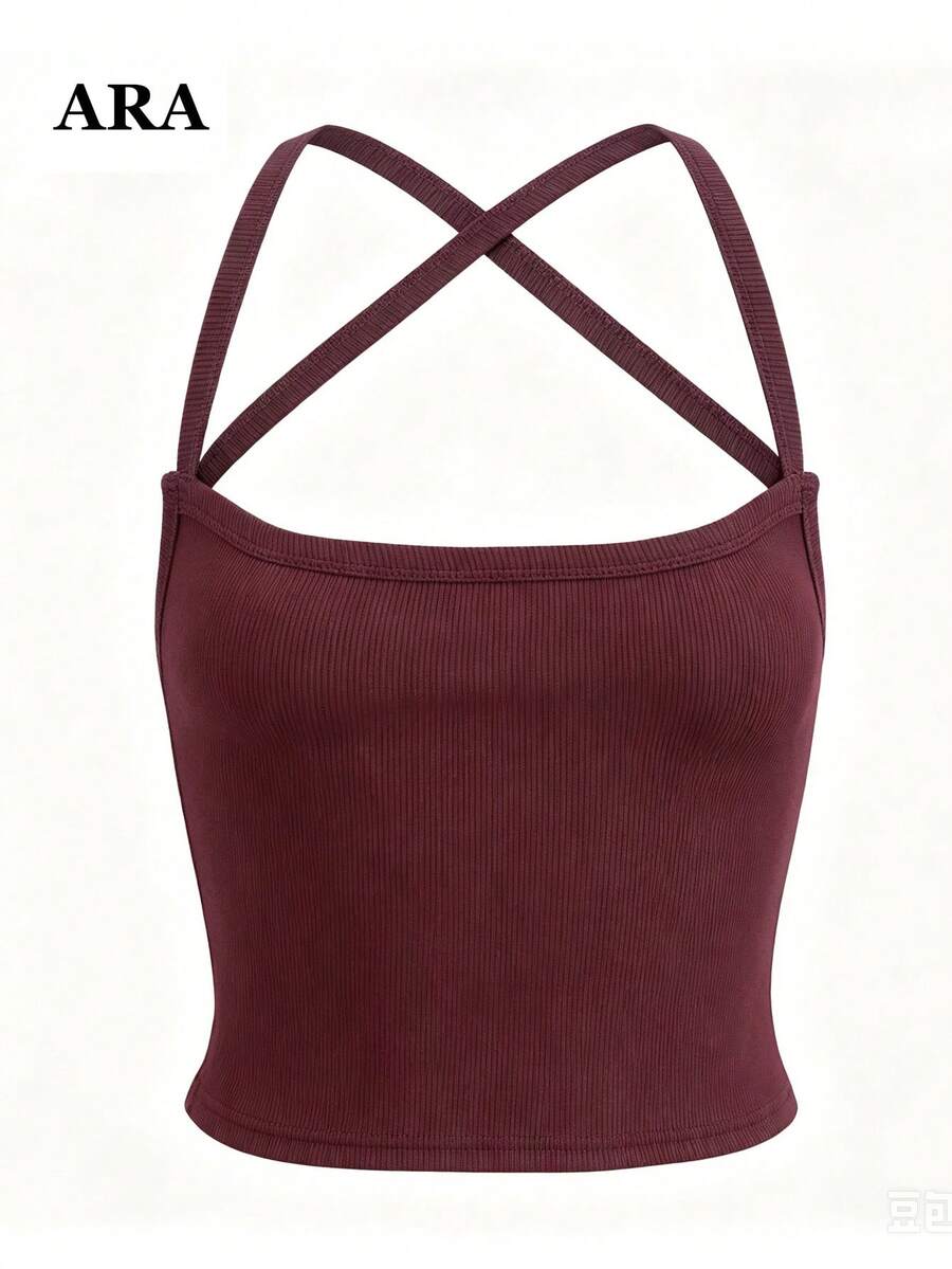 Women's striped crisscross spaghetti strap camisole top in a slim fit design