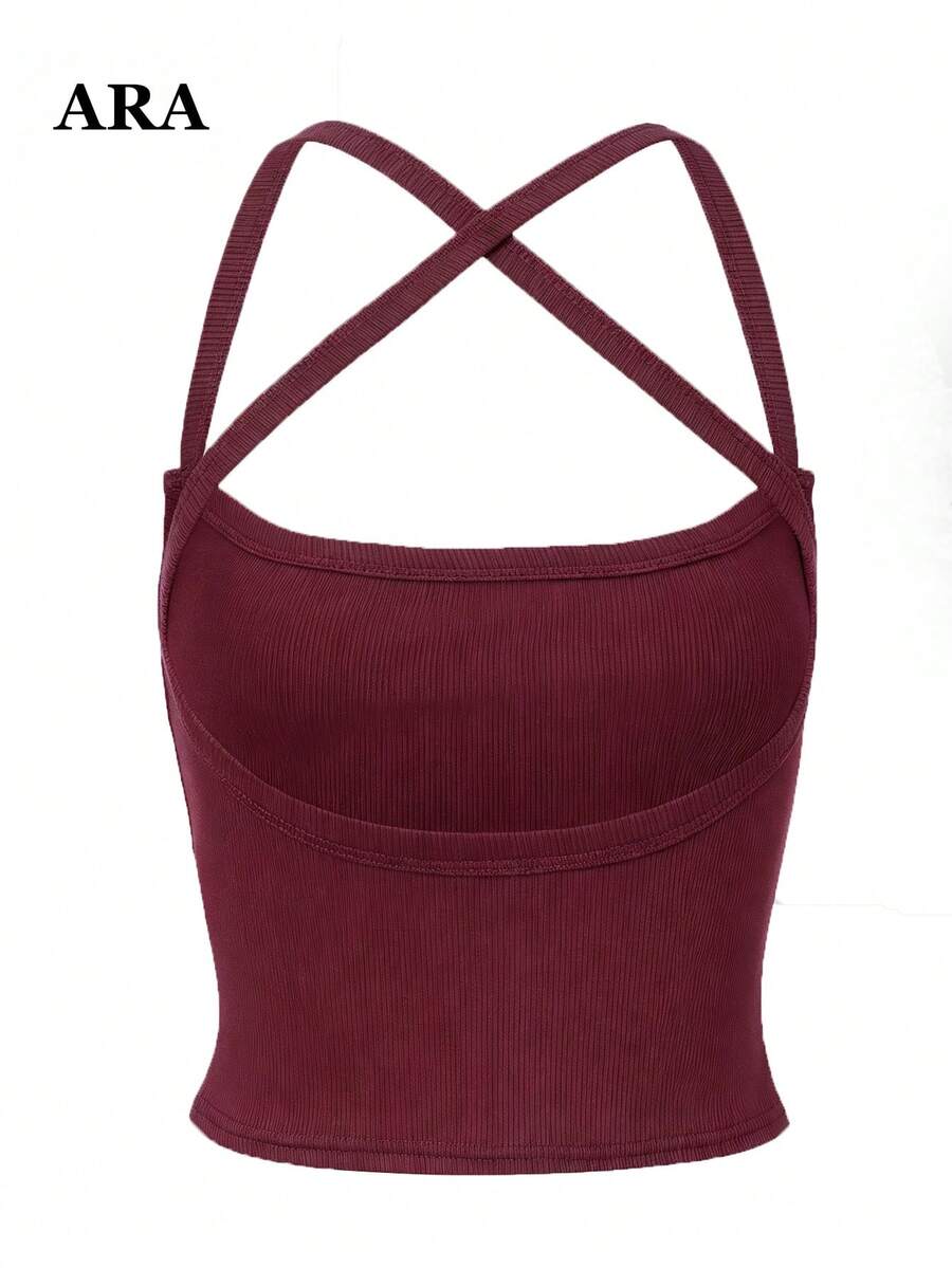 Women's striped crisscross spaghetti strap camisole top in a slim fit design